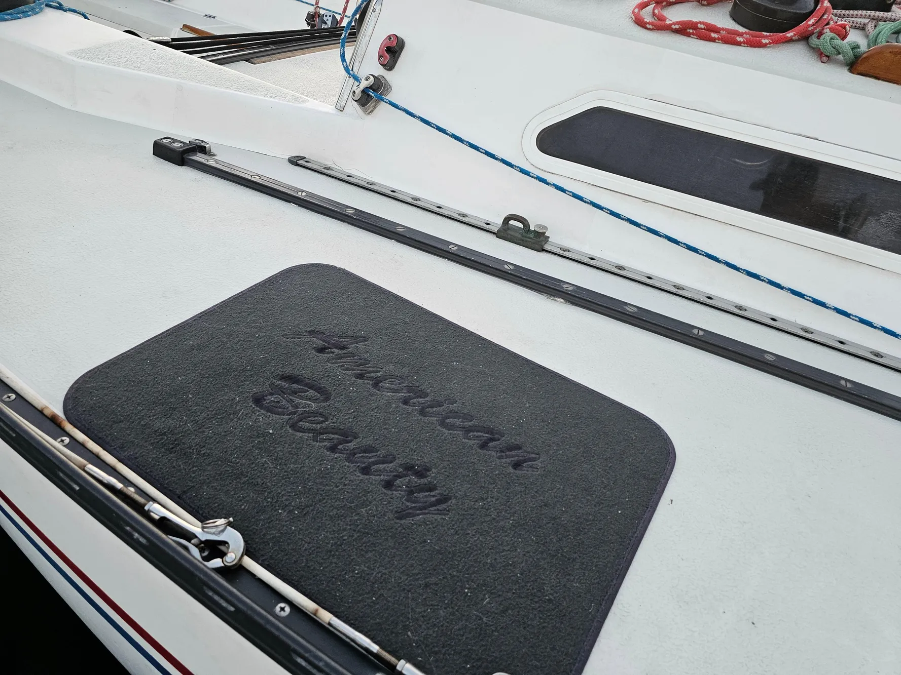 Deck of 1984 Schock NY 36 sailboat with "American Beauty" mat.