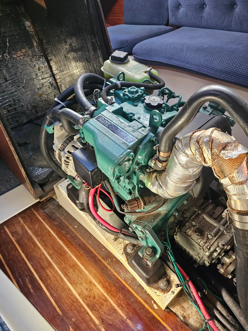 Engine of a 1984 Schock NY 36 sailboat, showcasing detailed components and wiring.