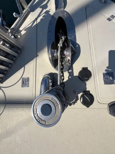 Lady Elaine Yacht Photos Pics Anchor winch on 1993 Kha Shing Motoryacht deck, featuring chain and marine hardware.