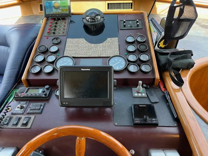 Lady Elaine Yacht Photos Pics Control panel of a 1993 Kha Shing Motoryacht with navigation instruments and gauges.