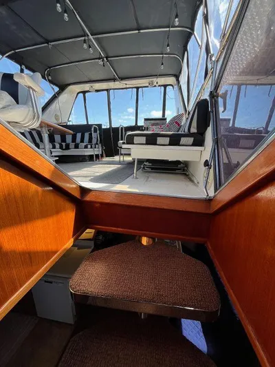 Lady Elaine Yacht Photos Pics Interior view of 1993 Kha Shing Motoryacht with seating and wooden stairs.