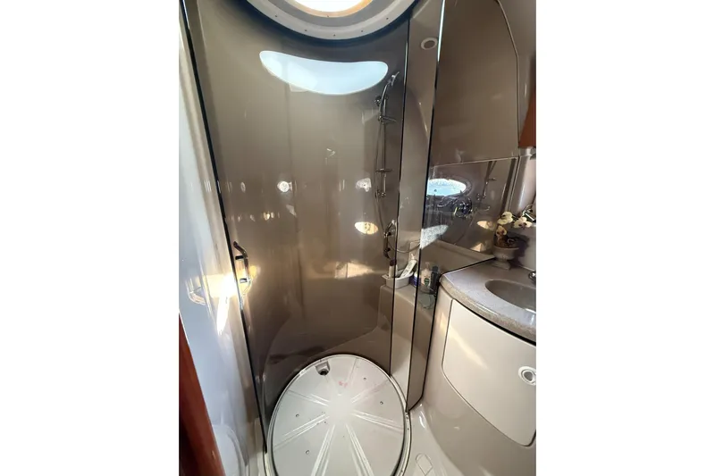 Amazing C's Yacht Photos Pics Bathroom interior of 2002 Regal Commodore 3860 yacht, featuring shower and sink.