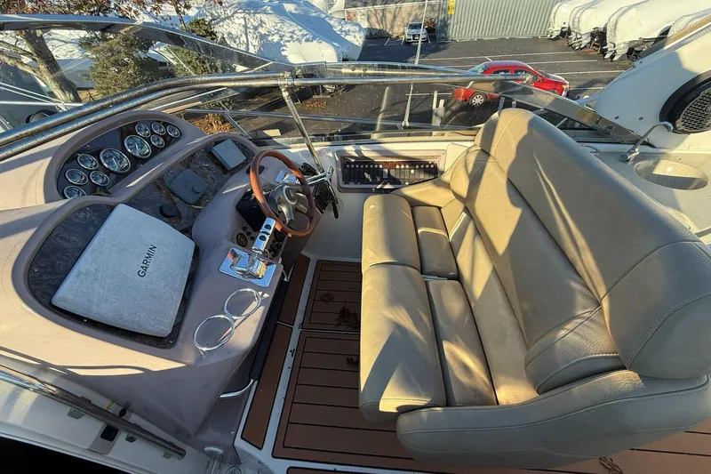 Amazing C's Yacht Photos Pics 2002 Regal Commodore 3860 boat cockpit with leather seating and Garmin navigation system.