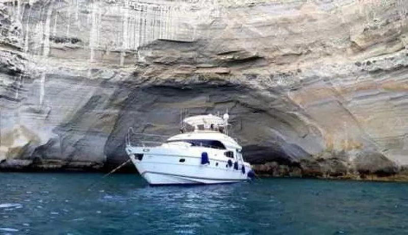  Yacht Photos Pics Luxury yacht Princess 65, 2004 model, anchored in a scenic sea cave.