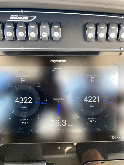Abvios Yacht Photos Pics 2020 Boston Whaler 330 Outrage dashboard with Raymarine display showing engine RPM and speed.