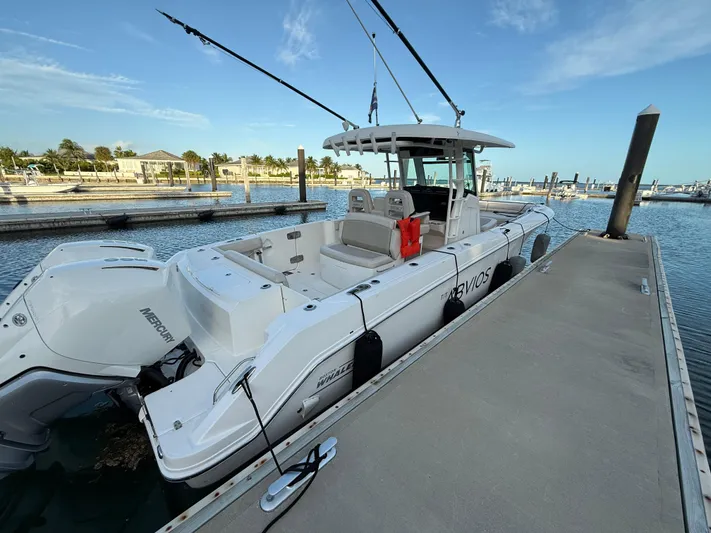 Abvios Yacht Photos Pics 2020 Boston Whaler 330 Outrage docked, featuring twin Mercury engines.