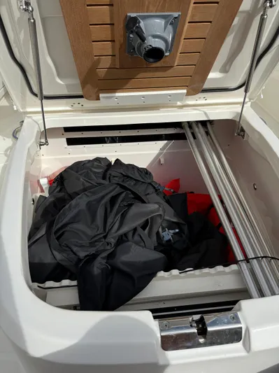 Abvios Yacht Photos Pics Storage compartment of 2020 Boston Whaler 330 Outrage boat with gear inside.