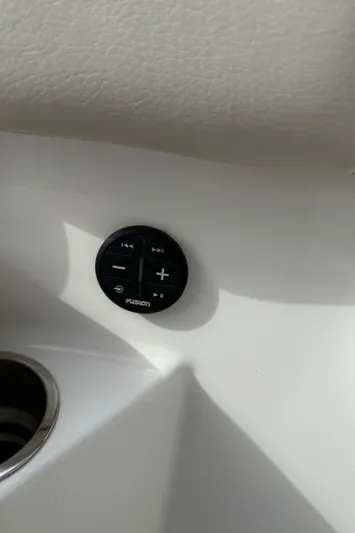 Abvios Yacht Photos Pics 2020 Boston Whaler 330 Outrage audio control panel on white interior.