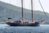 Custom 1993 Gulet Motorsailer sailing near lush, green hills.