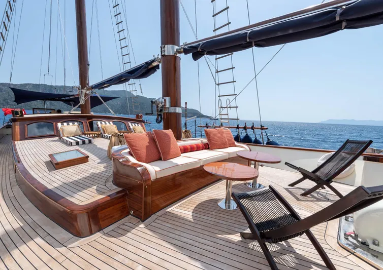 Ocean Pure Yacht Photos Pics Luxurious deck of 1993 Custom Gulet Motorsailer with seating and ocean view.