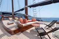 Luxurious deck of 1993 Custom Gulet Motorsailer with seating and ocean view.