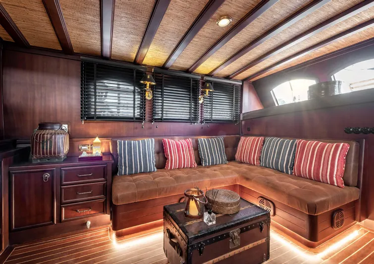 Ocean Pure Yacht Photos Pics Luxurious interior of 1993 Custom Gulet Motorsailer with cozy seating and nautical decor.