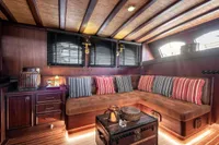 Luxurious interior of 1993 Custom Gulet Motorsailer with cozy seating and nautical decor.