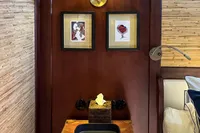 Cozy cabin interior of 1993 Custom Gulet Motorsailer with framed art and elegant lighting.