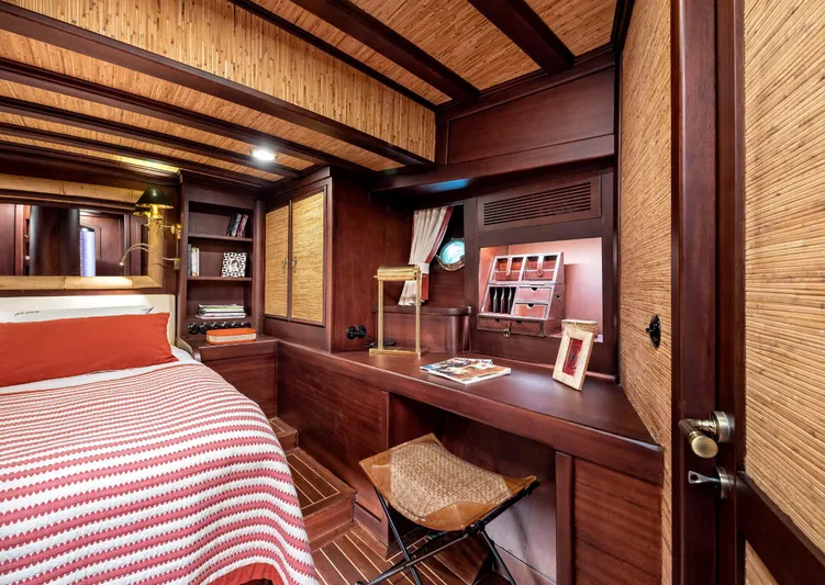 Ocean Pure Yacht Photos Pics Luxurious 1993 Custom Gulet Motorsailer cabin with wooden interior and cozy bedding.