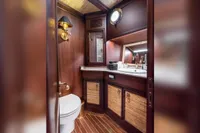Luxurious wooden bathroom interior on a 1993 Custom Gulet Motorsailer yacht.