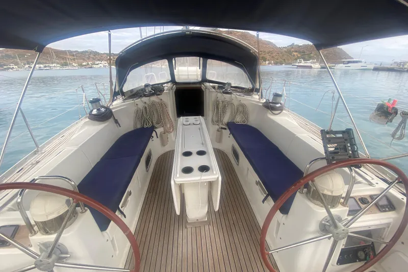  Yacht Photos Pics 2003 Jeanneau Sun Odyssey 45.2 sailboat cockpit with dual steering wheels and seating.