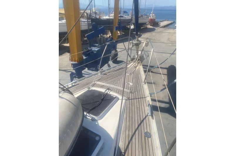  Yacht Photos Pics 2003 Jeanneau Sun Odyssey 45.2 sailboat on dry dock, showcasing deck and rigging.