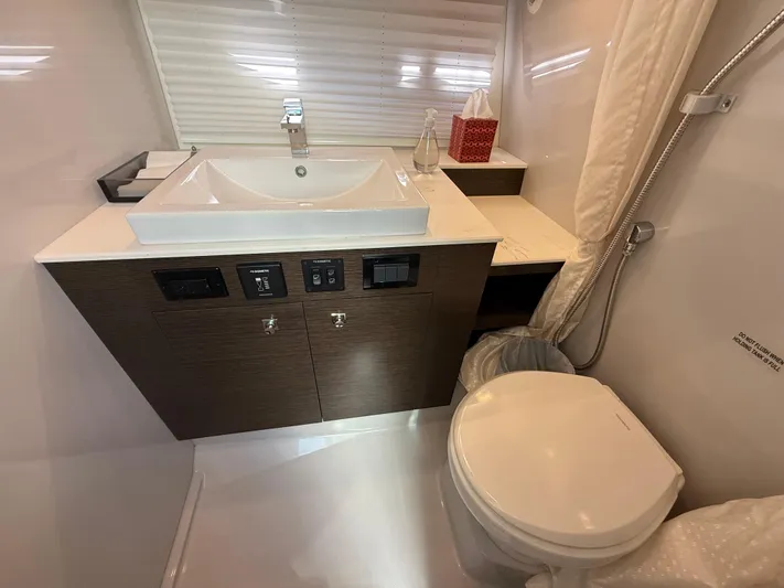  Yacht Photos Pics 2020 Cruisers Yachts 38 GLS OB bathroom with modern sink and toilet.