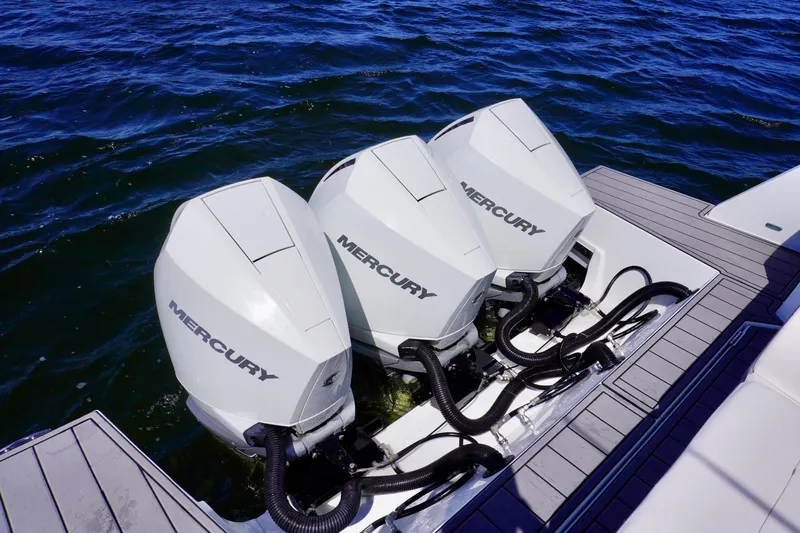  Yacht Photos Pics Triple Mercury outboard engines on a 2020 Cruisers Yachts 38 GLS OB, docked on water.