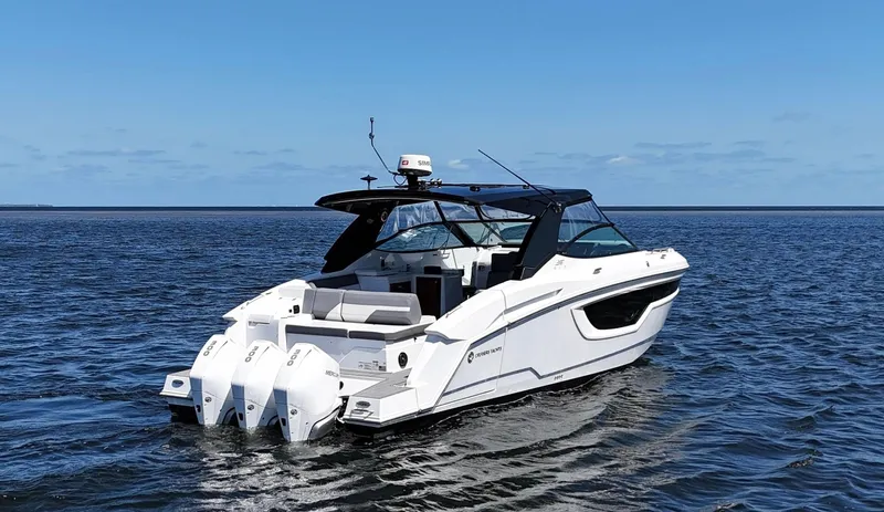  Yacht Photos Pics 2020 Cruisers Yachts 38 GLS OB on open water, featuring triple outboard engines.