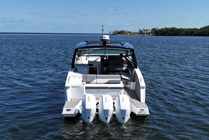  Yacht Photos Pics 2020 Cruisers Yachts 38 GLS OB on water, rear view with triple outboard engines.