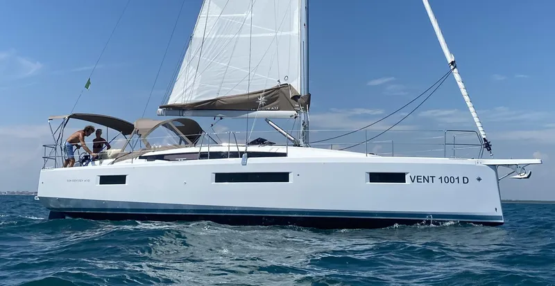 Vanilla IV Yacht Photos Pics 2023 Jeanneau Sun Odyssey 410 sailing on open water under clear skies.