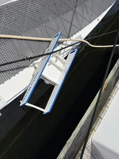  Yacht Photos Pics Boarding ladder on 2002 Silverton 410 Sport Bridge yacht, docked at marina.