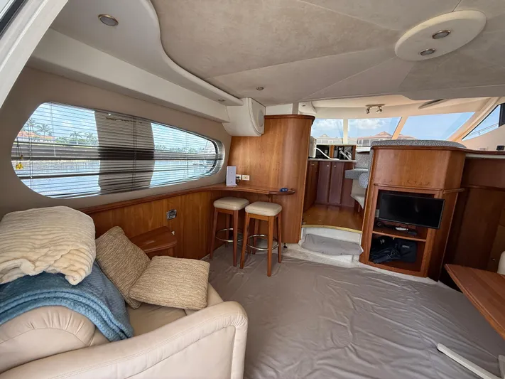  Yacht Photos Pics Luxurious interior of 2002 Silverton 410 Sport Bridge yacht with cozy seating and modern amenities.