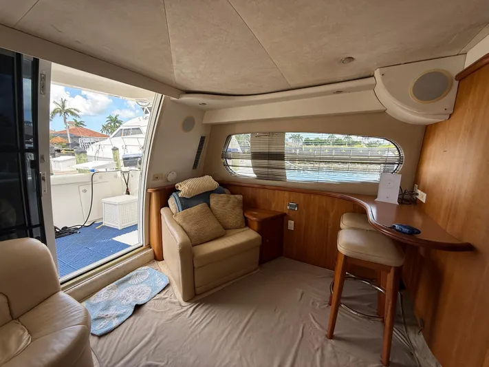  Yacht Photos Pics Interior of 2002 Silverton 410 Sport Bridge yacht with seating and window view.