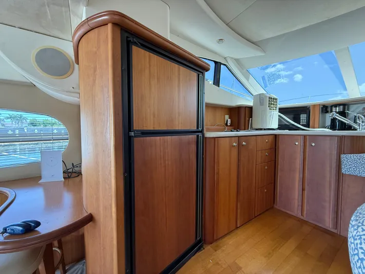  Yacht Photos Pics Interior of 2002 Silverton 410 Sport Bridge yacht with wooden cabinetry and modern amenities.