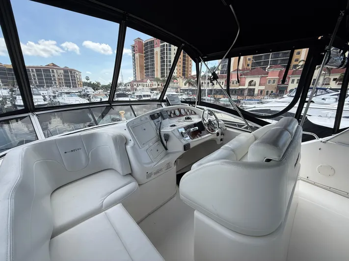  Yacht Photos Pics Interior view of 2002 Silverton 410 Sport Bridge yacht with marina backdrop.