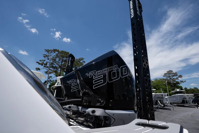  Yacht Photos Pics 2023 Sunsation 32 CCX boat with powerful Racing 300 engines under a clear blue sky.