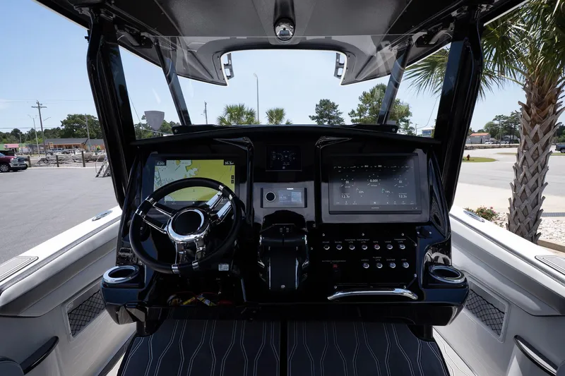  Yacht Photos Pics 2023 Sunsation 32 CCX boat dashboard with modern controls and steering wheel.