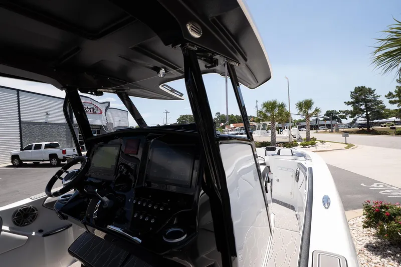  Yacht Photos Pics 2023 Sunsation 32 CCX boat dashboard with modern controls and navigation system.