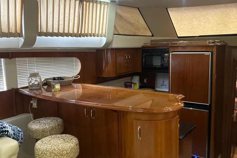  Yacht Photos Pics Interior of 2003 Carver 466 Motor Yacht with wooden cabinetry and modern amenities.