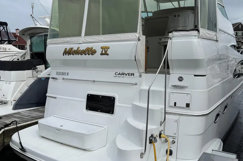  Yacht Photos Pics 2003 Carver 466 Motor Yacht docked, featuring "Michelle IV" name on the stern.