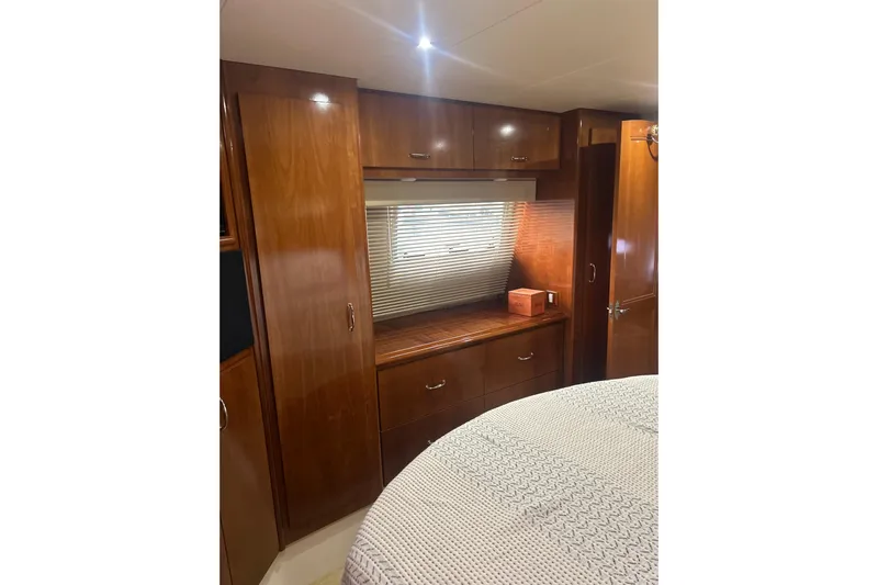  Yacht Photos Pics Interior of 2003 Carver 466 Motor Yacht with wooden cabinetry and window blinds.
