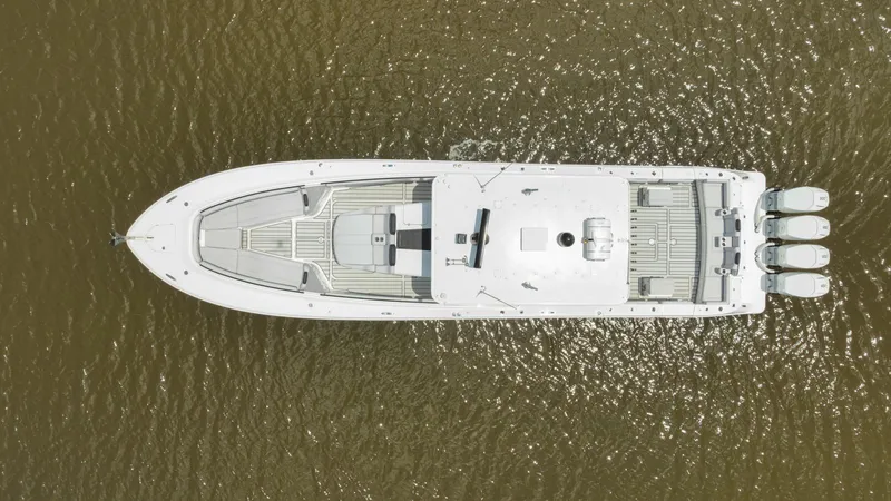 Traveller Yacht Photos Pics Top view of 2021 HCB Suenos boat on water, showcasing sleek design and powerful engines.