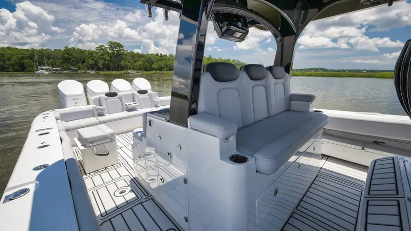 Traveller Yacht Photos Pics 2021 HCB Suenos boat interior with luxurious seating and multiple outboard engines.