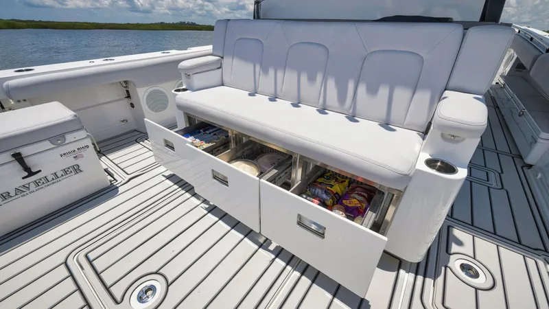 Traveller Yacht Photos Pics 2021 HCB Suenos boat with open storage drawers on deck, showcasing snacks and supplies.