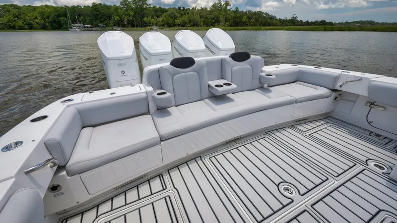 Traveller Yacht Photos Pics 2021 HCB Suenos boat with spacious seating and four powerful outboard engines.