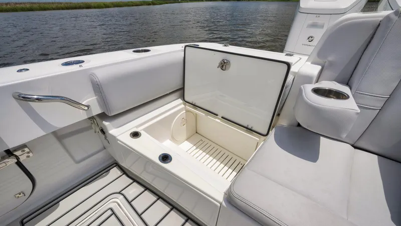 Traveller Yacht Photos Pics 2021 HCB Suenos boat interior with open storage compartment and seating.