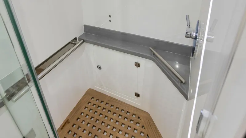 Traveller Yacht Photos Pics Shower area in 2021 HCB Suenos boat with wooden floor and modern fixtures.