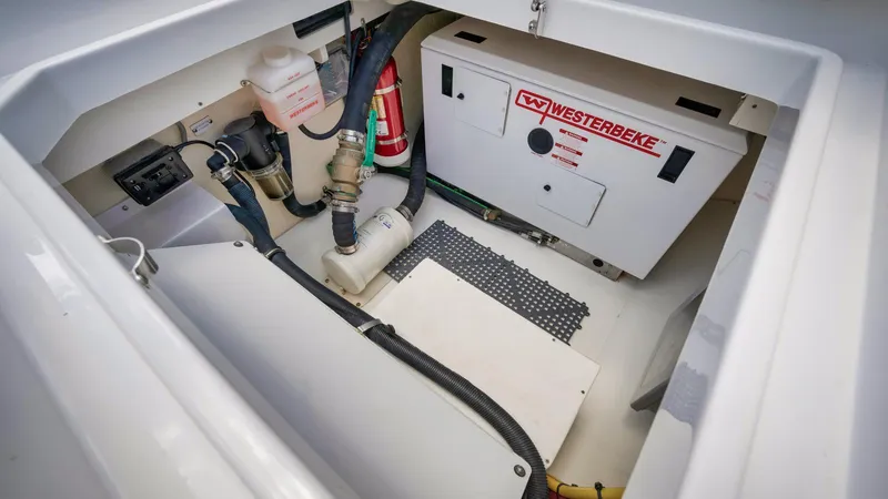 Traveller Yacht Photos Pics Engine compartment of 2021 HCB Suenos boat with Westerbeke generator and safety equipment.