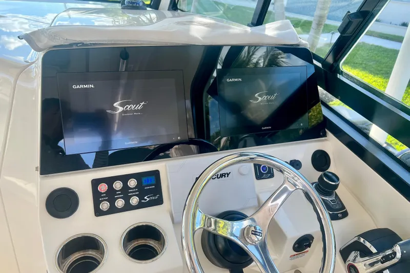 Yacht Photos Pics 2023 Scout 350 LXZ boat dashboard with Garmin displays and steering wheel.