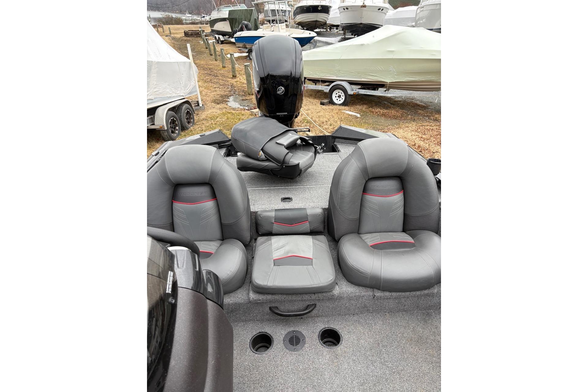2023 Tracker Pro Team 175 TXW boat interior with gray seating and motor.
