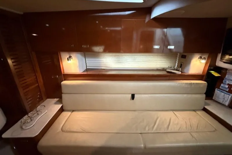  Yacht Photos Pics Luxurious interior of 2011 Sea Ray Sundancer 370 yacht with beige seating and wooden cabinetry.