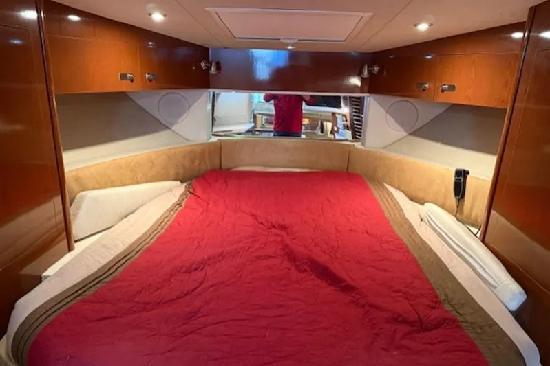 Yacht Photos Pics Luxurious cabin interior of 2011 Sea Ray Sundancer 370 with red bedding.