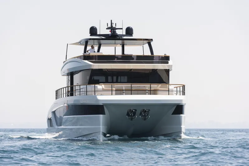 Lazzara Lpc 300 Yacht Photos Pics Front view of 2027 Lazzara LPC 300 yacht cruising on open water.